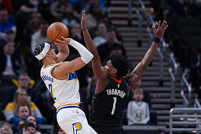 | Photo: AP/Michael Conroy : Indiana Pacers guard Andrew Nembhard (2) shoots over Houston Rockets guard/forward Amen Thompson (1) during the second half of an NBA basketball game in Indianapolis.