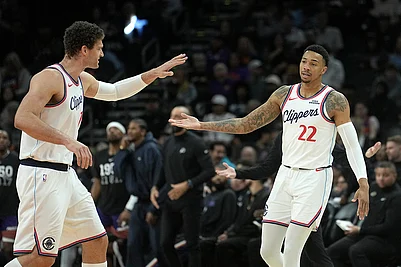 | Photo: AP/Ross D. Franklin : Los Angeles Clippers guard Jordan Miller (22) celebrates a 3-pointer against the Phoenix Suns with Clippers center Brook Lopez during the second half of an NBA basketball game in Phoenix.