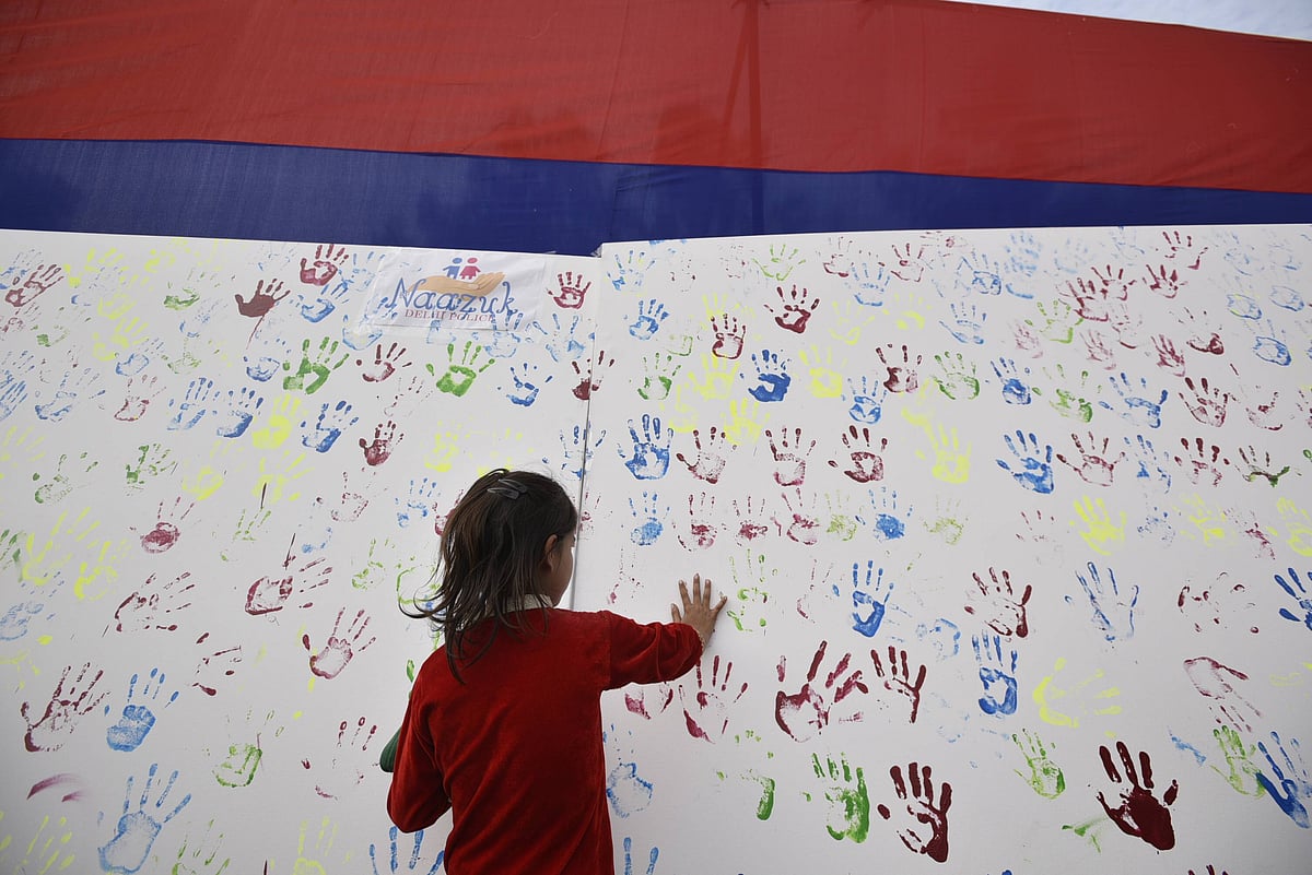  A girl seen putting her handprint over an installation during an awareness campaign program initiated by Delhi Police for those children who were missing and kidnapped but later been reunited, at DCP Complex, on February 21, 2019 in New Delhi, India. Over 130 missing children were reunited with their families by the Anti-Human Trafficking Unit (AHTU) of northeast district police in 2018 and 2019. (Photo by Biplov Bhuyan Hindustan Times)
Source: IMAGO / Hindustan Times 
