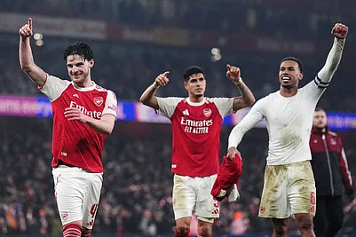 Photo: John Walton/PA via AP : Arsenal players, from left, Declan Rice, Piero Hincapie and Gabriel celebrate after the English League Cup semifinal second leg soccer match between Arsenal and Chelsea in London.