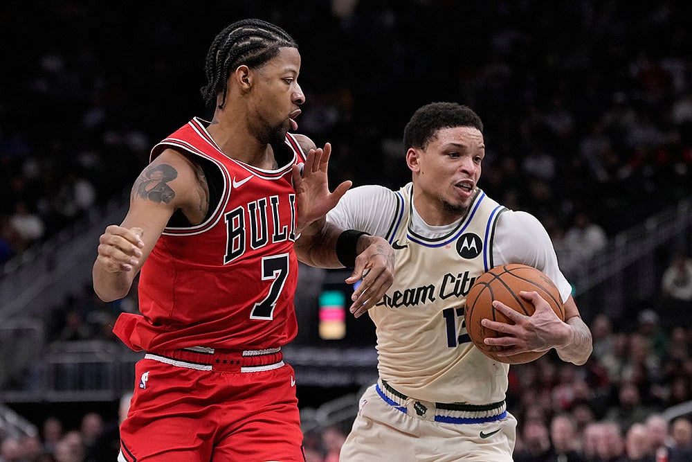 | Photo: AP/Morry Gash : Milwaukee Bucks Ryan Rollins tries to get past Chicago Bulls Dalen Terry during the second half of an NBA basketball game in Milwaukee.