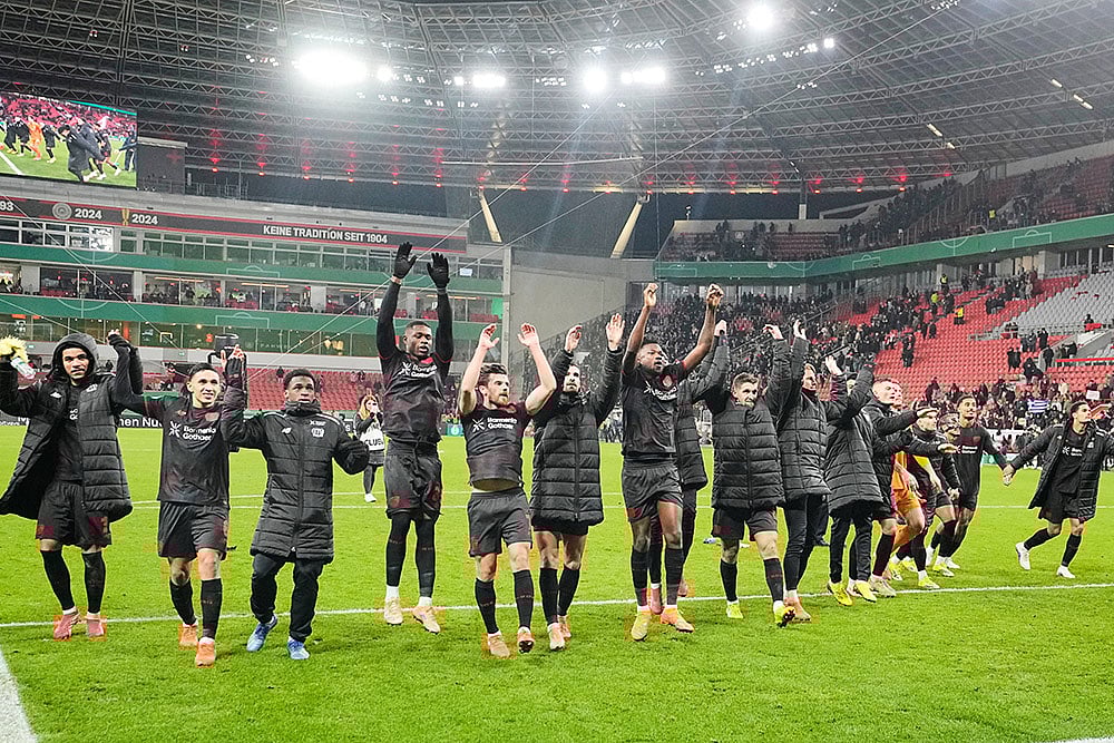 | Photo: AP/Martin Meissner : Leverkusen players celebrate after a DFB Pokal, German Cup quarter final soccer match between Leverkusen and St. Pauli in Leverkusen, Germany.