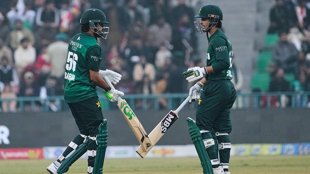 AP : Pakistans Babar Azam, left, and Saim Ayub bat during the third T20I against Australia in Lahore.