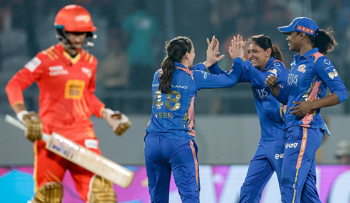 PTI : Mumbai Indians Amelia Kerr, back left, celebrates with captain Harmanpreet Kaur, back centre, and Hayley Matthews, right, after taking the wicket of Gujarat Giants captain Anushka Sharma during a Womens Premier League (WPL) 2026 
