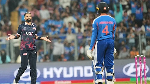 | Photo: AP/Rafiq Maqbool : United States Ali Khan, left, celebrates the wicket of Indias Abhishek Sharma, right, during the T20 World Cup cricket match between India and the United States in Mumbai.