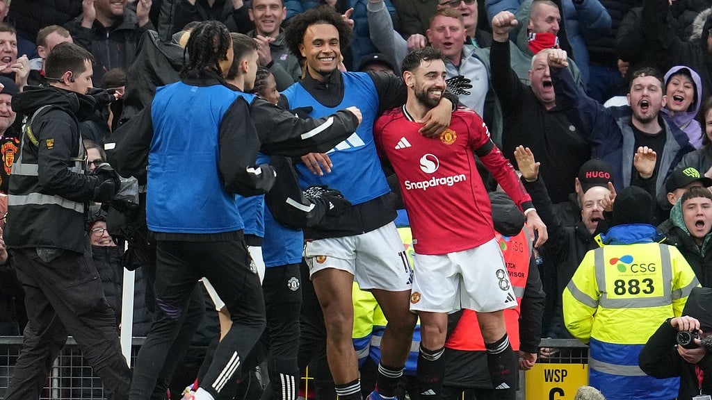 Photo: AP : Manchester United's Bruno Fernandes celebrates after scoring during the English Premier League match between Manchester United and Tottenham in Manchester.