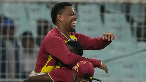(AP Photo/Bikas Das) : West Indies Shimron Hetmyer, left, celebrators with teammates after taking the catch to dismiss Scotlands George Munsey during the T20 World Cup cricket match between Scotland and West Indies in Kolkata, India, Saturday, Feb. 7, 2026