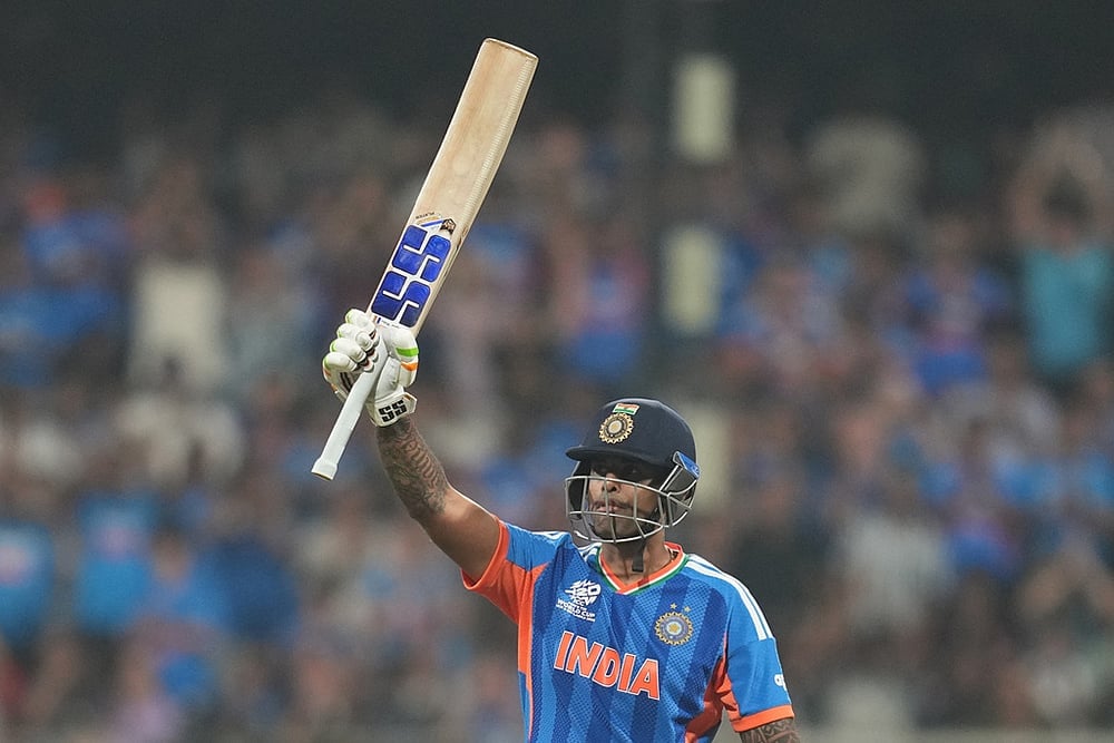 | Photo: AP/Rafiq Maqbool : Indias captain Suryakumar Yadav celebrates his fifty runs during the T20 World Cup cricket match between India and the United States in Mumbai.