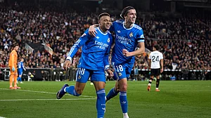 Kylian Mbappe and Alvaro Carreras celebrate.