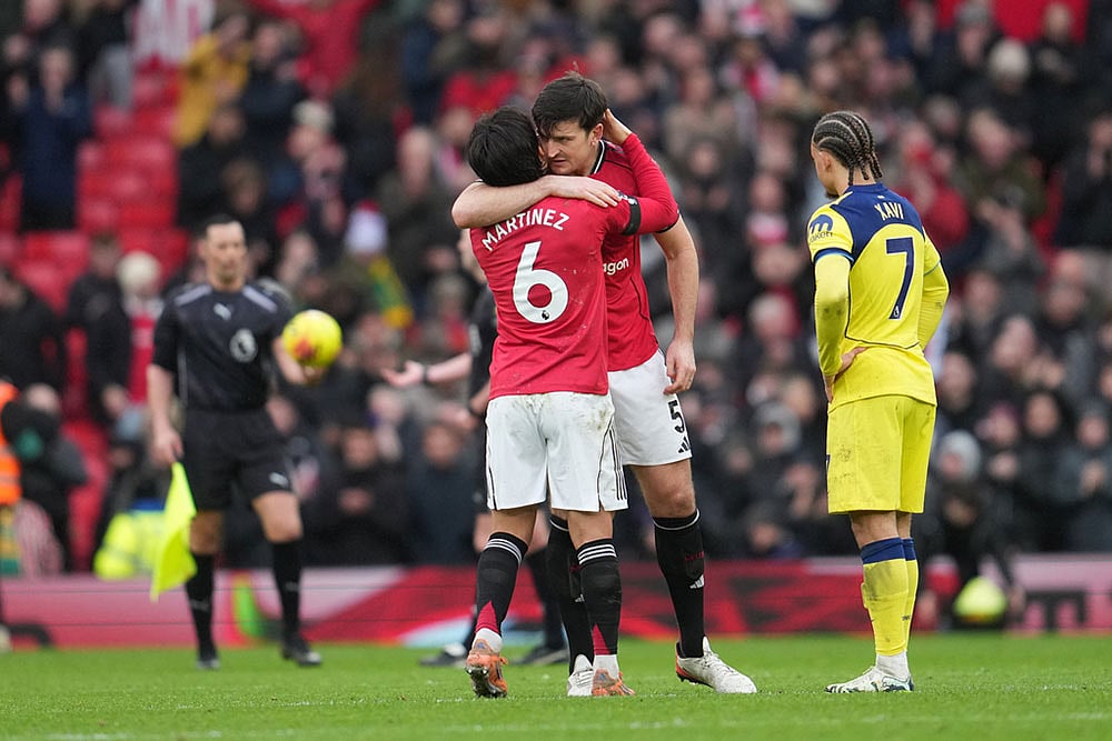 | Photo: AP/Jon Super : Manchester Uniteds Lisandro Martinez and Harry Maguire hug after the English Premier League soccer match between Manchester United and Tottenham in Manchester, England.