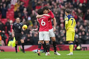 | Photo: AP/Jon Super : Manchester United's Lisandro Martinez and Harry Maguire hug after the English Premier League soccer match between Manchester United and Tottenham in Manchester, England.