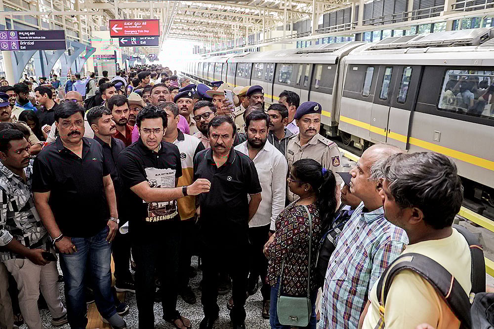 Photo: PTI : BJP MP Tejasvi Surya interacts with commuters at RV Road Metro Station over concerns regarding the proposed Bengaluru Metro fare revision, in Bengaluru, Karnataka.