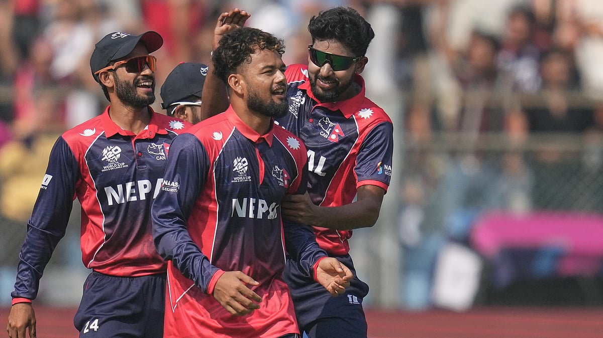 (AP Photo/Rafiq Maqbool) : Nepals Sher Malla, second left, celebrates with teammates the wicket of Englands Phil Salt during the T20 World Cup cricket match between England and Nepal in Mumbai, India, Sunday,Feb. 8, 2026