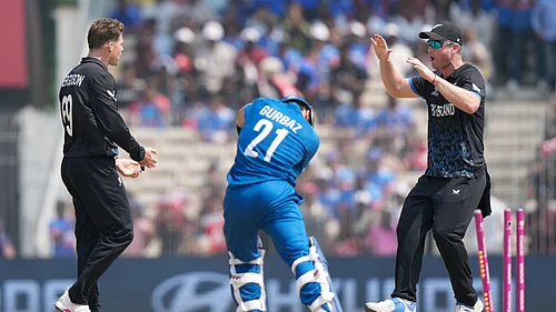 (AP Photo/Mahesh Kumar A.) : Afghanistans Rahmanullah Gurbaz, center, is bowled out by New Zealands Lockie Ferguson, left, during the T20 World Cup cricket match between Afghanistan and New Zealand in Chennai, India, Sunday, Feb. 8, 2026.