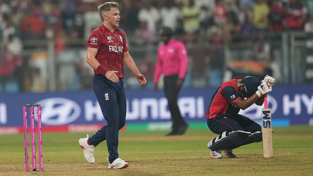 (AP Photo/Rafiq Maqbool) : Englands Sam Curran celebrates after wining against Nepal during the T20 World Cup cricket match in Mumbai, India, Sunday,Feb. 8, 2026