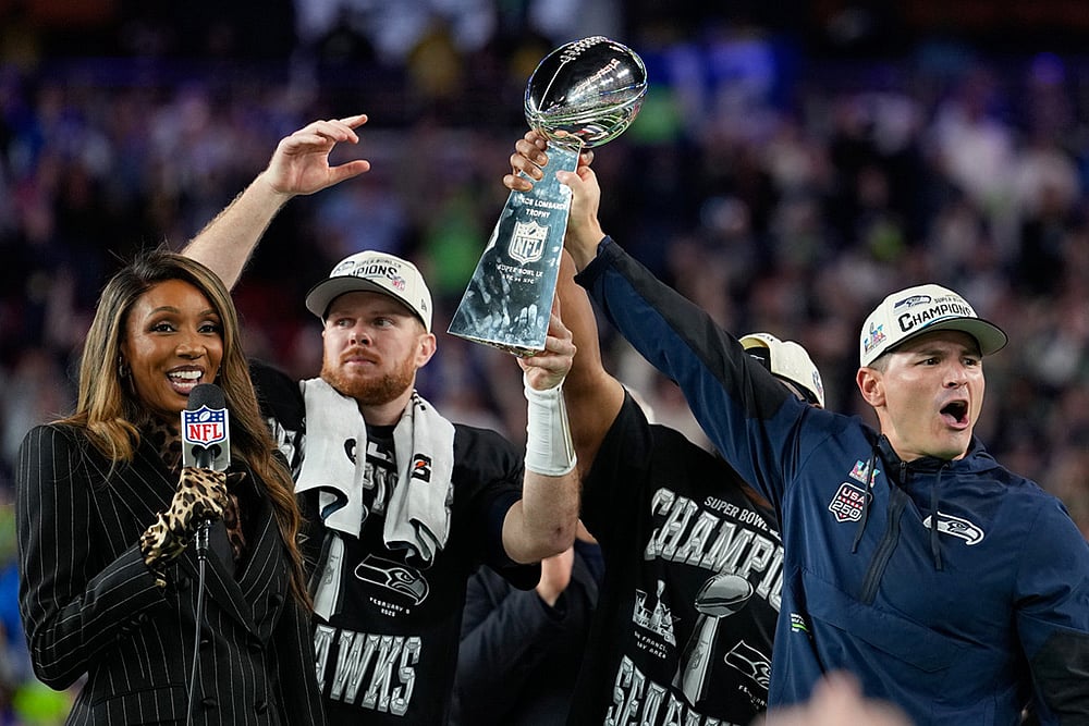 | Photo: AP/Julio Cortez : Seattle Seahawks head coach Mike MacDonald, right, and quarterback Sam Darnold lift the Lombardi Trophy after win over the New England Patriots in the NFL Super Bowl 60 football game in Santa Clara, California.