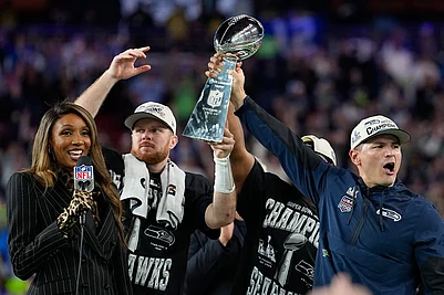 | Photo: AP/Julio Cortez : Seattle Seahawks head coach Mike MacDonald, right, and quarterback Sam Darnold lift the Lombardi Trophy after win over the New England Patriots in the NFL Super Bowl 60 football game in Santa Clara, California.