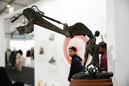 Vikram Sharma : Debanjan Roy’s sculpture at India Art Fair places a modest Gandhi under the looming arm of a bulldozer