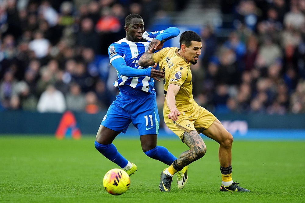 | Photo: Adam Davy/PA via AP : Brighton and Hove Albion's Yankuba Minteh, left, and Crystal Palace's Daniel Munoz in action during their English Premier League soccer match in Brighton, England.