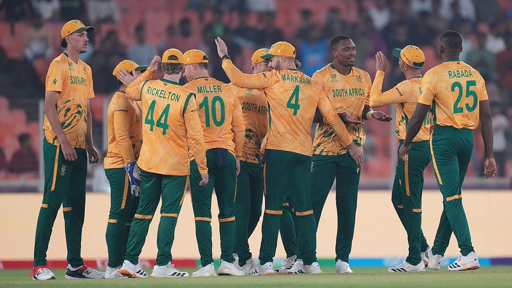 Photo: AP : South Africas Lungi Ngidi, third from right, celebrates with teammates the wicket of Canadas Yuvraj Samra during the T20 World Cup match between Canada and South Africa in Ahmedabad.