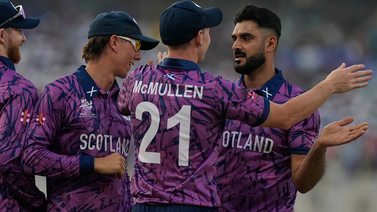 | Photo: AP/Bikas Das : Scotlands Safyaan Sharif, right, celebrates with teammates the wicket of West Indies Shimron Hetmyer during the T20 World Cup cricket match between Scotland and West Indies in Kolkata, India, Saturday, Feb. 7, 2026. 