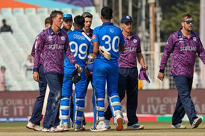 | Photo: AP/Bikas Das : Italys Ali Hasan and Crishan Jorge congratulate Scotland players on wining the T20 World Cup cricket match in Kolkata.