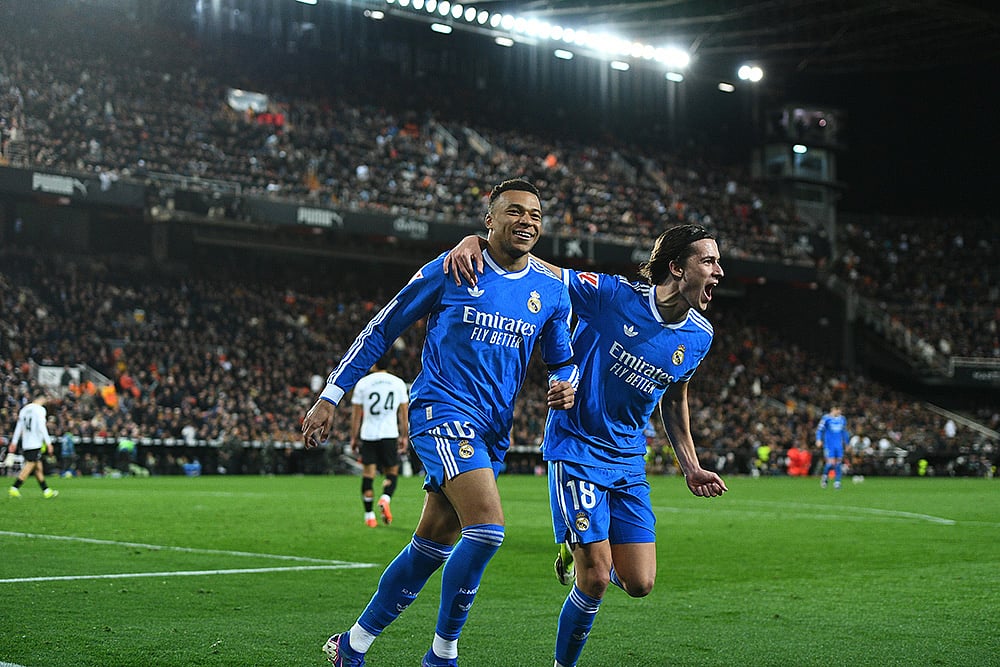 | Photo: AP/Francisco Macia : Real Madrids Kylian Mbappe, left, celebrates with Alvaro Carreras after scoring his sides second goal during the Spanish La Liga soccer match between Valencia and Real Madrid in Valencia, Spain.