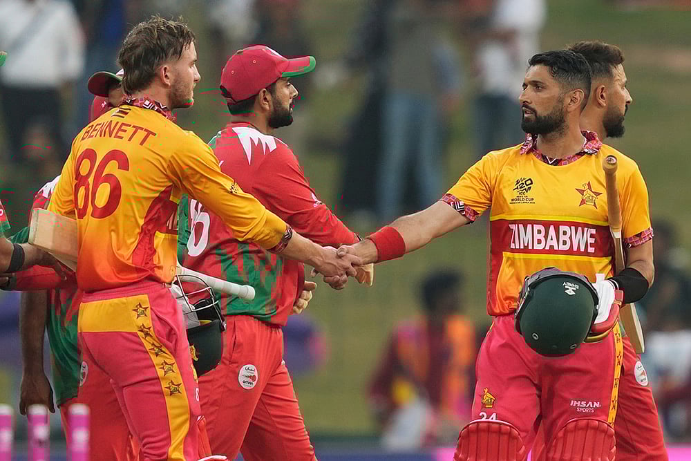 | Photo: AP/Eranga Jayawardena : Zimbabwes captain Sikandar Raza, right, Brian Bennett, left, celebrate after winning their T20 World Cup cricket match against Oman in Colombo, Sri Lanka.