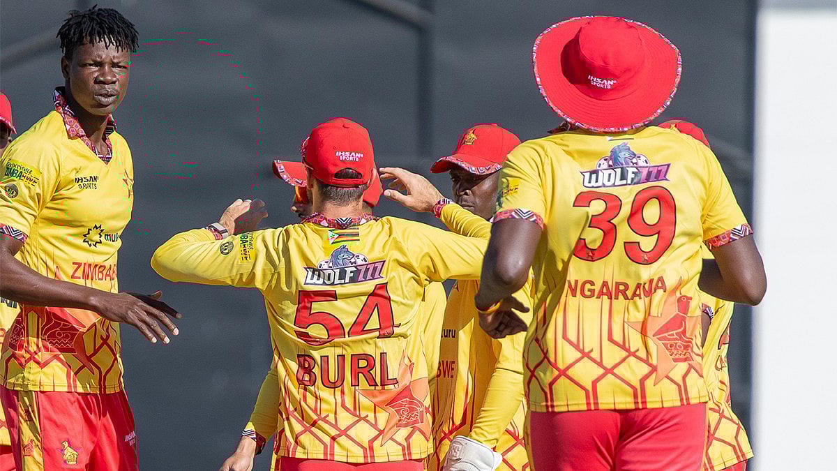| Photo: X/ZimCricketv : Zimbabwe players celebrate a wicket during the ICC T20 World Cup warm-up match gainst Oman on February 5, 2026.