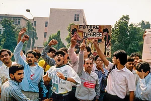 Past Protest: Students protesting in 1990 against the recommendations of the Mandal Commission for quotas in government jobs for backward castes with signs including anti-PM V. P. Singh