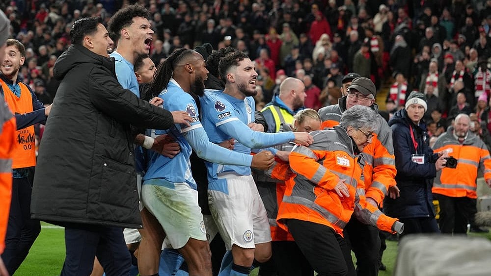 | Photo: AP/Jon Super : Manchester City players celebrate after the English Premier League soccer match between Liverpool and Manchester City in Liverpool, England.
