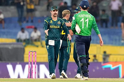 Photo: AP/Eranga Jayawardena : Australias captain Travis Head, left, walks to shake hands with Irelands Matthew Humphreys after Australia won the T20 World Cup cricket match against Ireland in Colombo, Sri Lanka.