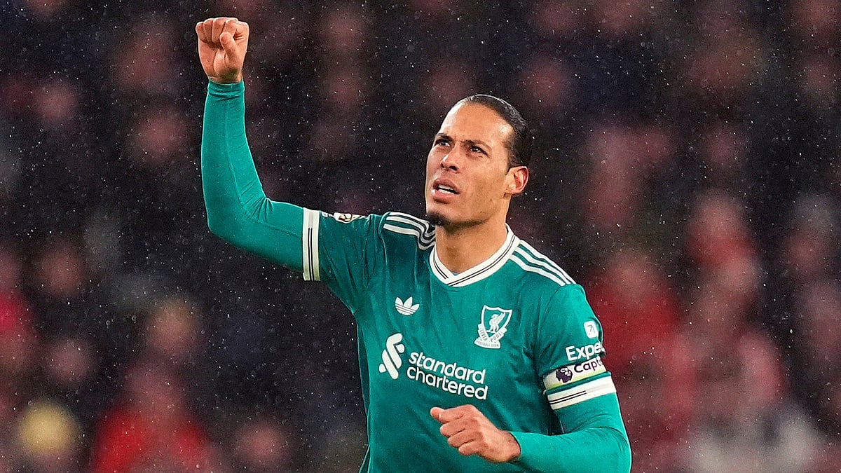 (Danny Lawson/PA via AP) : Liverpools Virgil van Dijk celebrates scoring their sides first goal of the game during the English Premier League soccer match against Sunderland, in Sunderland, England, Wednesday, Feb. 11, 2026