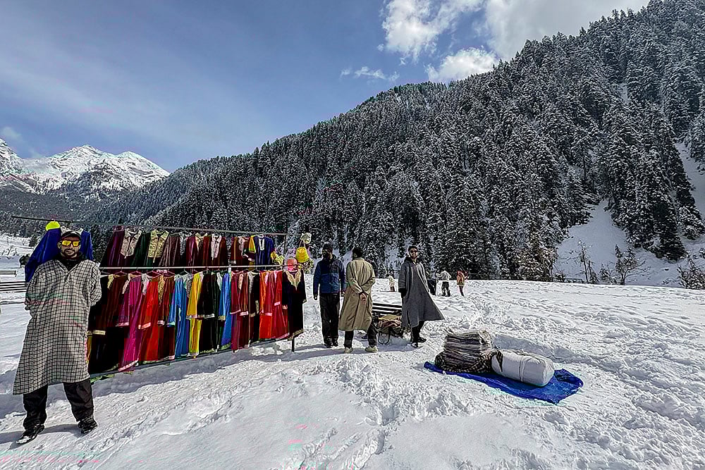 | Photo: PTI : Vendors put up a clothing stall during the Snow Festival at Aru Valley, in Anantnag, Jammu and Kashmir.