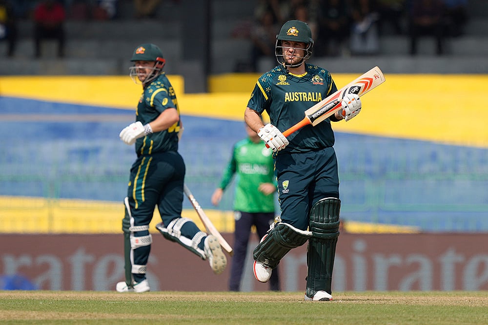 | Photo: AP/Eranga Jayawardena : Australias Josh Inglis, right, and captain Travis Head run between the wickets during the T20 World Cup cricket match between Australia and Ireland in Colombo, Sri Lanka.