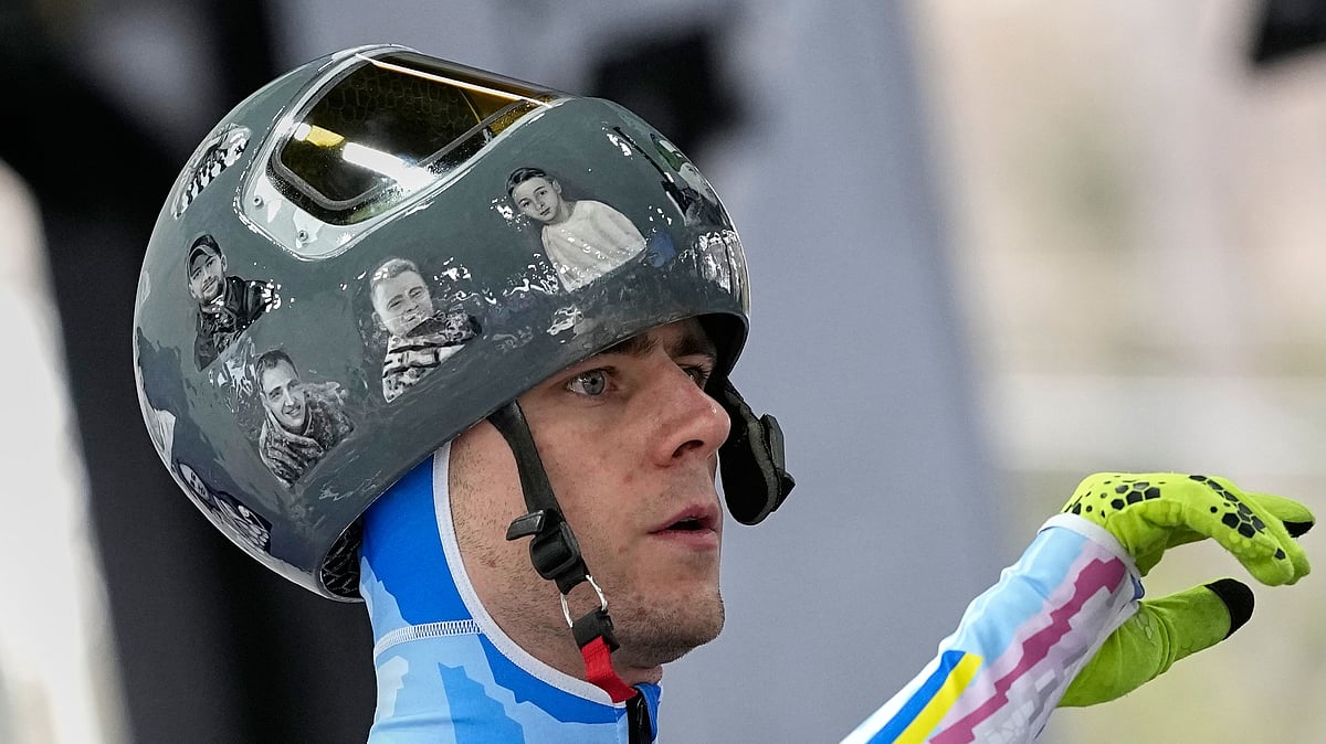 (AP Photo/Alessandra Tarantino) : Ukraines Vladyslav Heraskevych arrives at the finish during a mens skeleton training session at the 2026 Winter Olympics, in Cortina dAmpezzo, Italy, Tuesday, Feb. 10, 2026. 