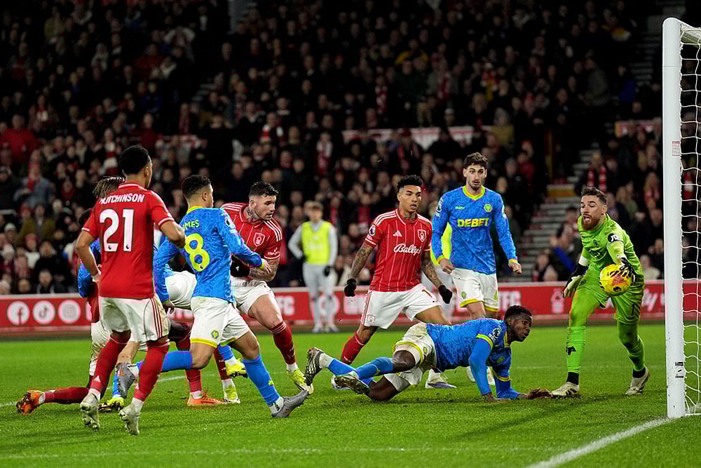 | Photo: Joe Giddens/PA via AP : Nottingham Forests Morato, center, has a shot saved by Wolverhampton Wanderers goalkeeper Jose Sa, right, during the English Premier League soccer match between Nottingham Forest and Wolverhampton Wanderers, in Nottingham, England.