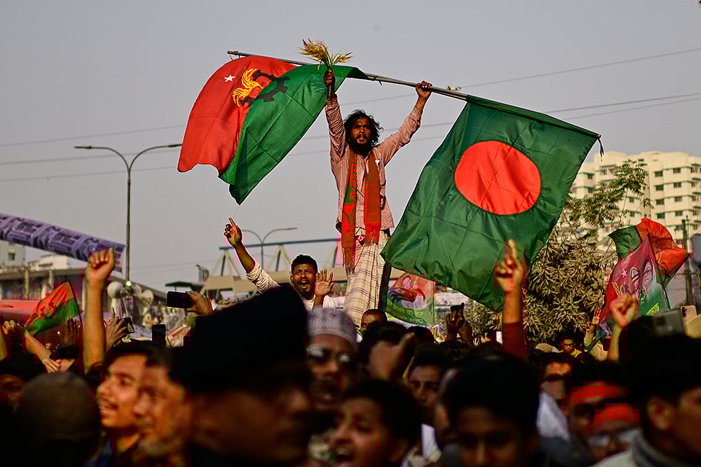 | Photo: AP/Mahmud Hossain Opu : Supporters of Bangladesh Nationalist Party (BNP) cheer during an election rally of their party Chairperson Tarique Rahman in Dhaka, Bangladesh.