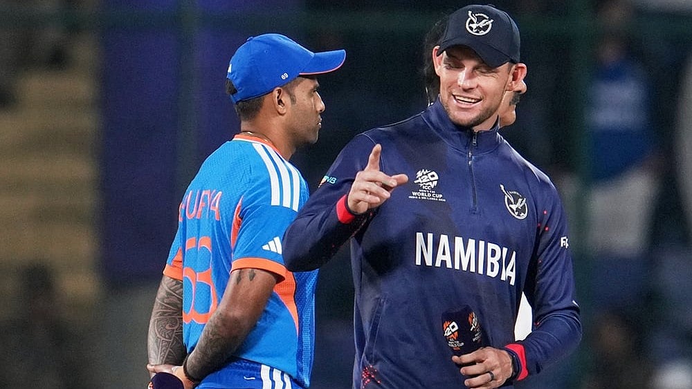 | Photo: AP/Manish Swarup : Namibias captain Gerhard Erasmus, right, and Indias captain Suryakumar Yadav chat before the coin toss of the T20 World Cup cricket match between India and Namibia in New Delhi.