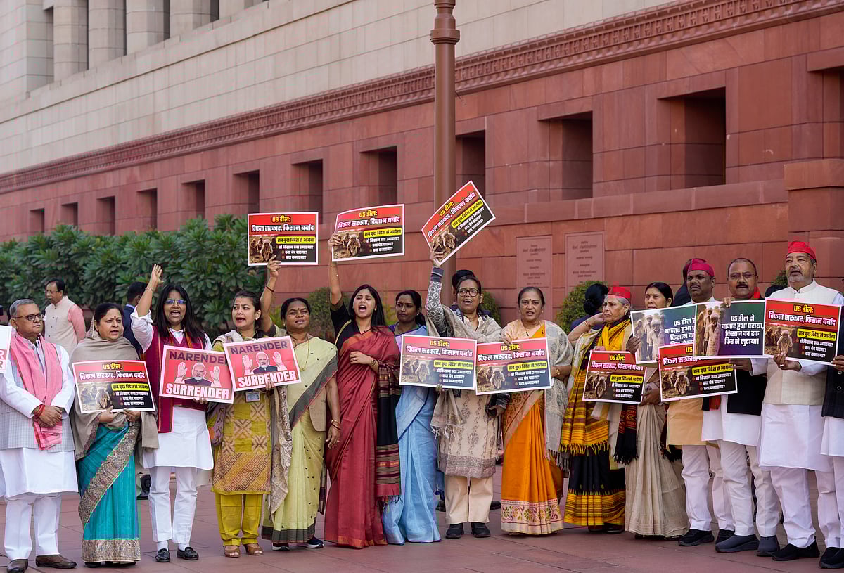  PTI : Samajwadi Party (SP) MP Priya Saroj, centre, Congress MP Praniti Shinde, fourth left, and others stage a protest over the India-US interim trade deal, during the Budget session of Parliament, in New Delhi, Thursday, Feb. 12, 2026. 