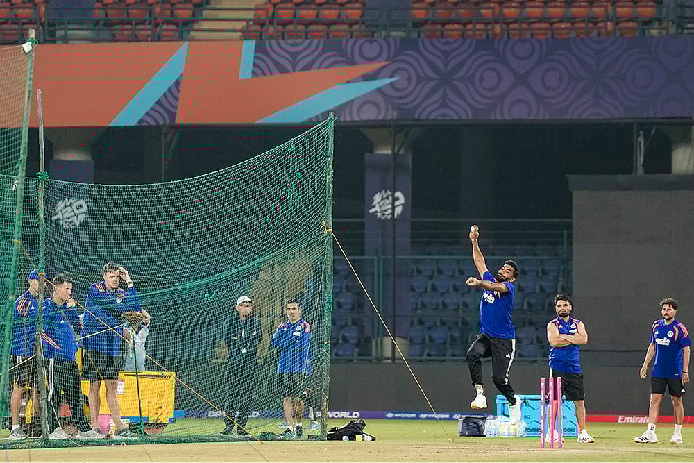 | Photo: PTI/Salman Ali : Indias Jasprit Bumrah bowls a delivery during a practice session ahead of an ICC Mens T20 World Cup 2026 cricket match between India and Namibia, at the Arun Jaitley Stadium, in New Delhi. BCCI selection committee Chairman Ajit Agarkar, the team’s head coach Gautam Gambhir, bowling coach Morne Morkel and players Rinku Singh and Kuldeep Yadav are also seen.