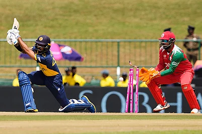 | Photo: AP/Eranga Jayawardena : Sri Lankas Kamil Mishara bowled out by Omans Jay Odedra during the T20 World Cup cricket match between Oman and Sri Lanka in Pallekele, Sri Lanka.
