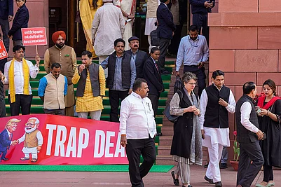 | Photo: PTI/Salman Ali : Congress MP Priyanka Gandhi Vadra, suspended MPs Hibi Eden, Dean Kuriakose, Prashant Padole, Manickam Tagore and other opposition MPs stage a protest over the India-US interim trade deal, accusing the government of surrendering Indian interests, during the Budget session of Parliament, in New Delhi.