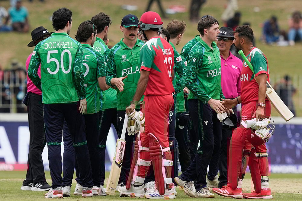 | Photo: AP/Eranga Jayawardena : Irelands players shake hands with Omans players after they won the T20 World Cup cricket match against Oman in Colombo, Sri Lanka.
