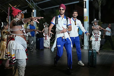 | Photo: PTI/Arun Sharma : Indias Arshdeep Singh and Axar Patel dance as they are being welcomed with a performance by artistes upon their arrival at the airport, ahead of an ICC Mens T20 World Cup 2026 cricket match between India and Pakistan, in Colombo, Sri Lanka.