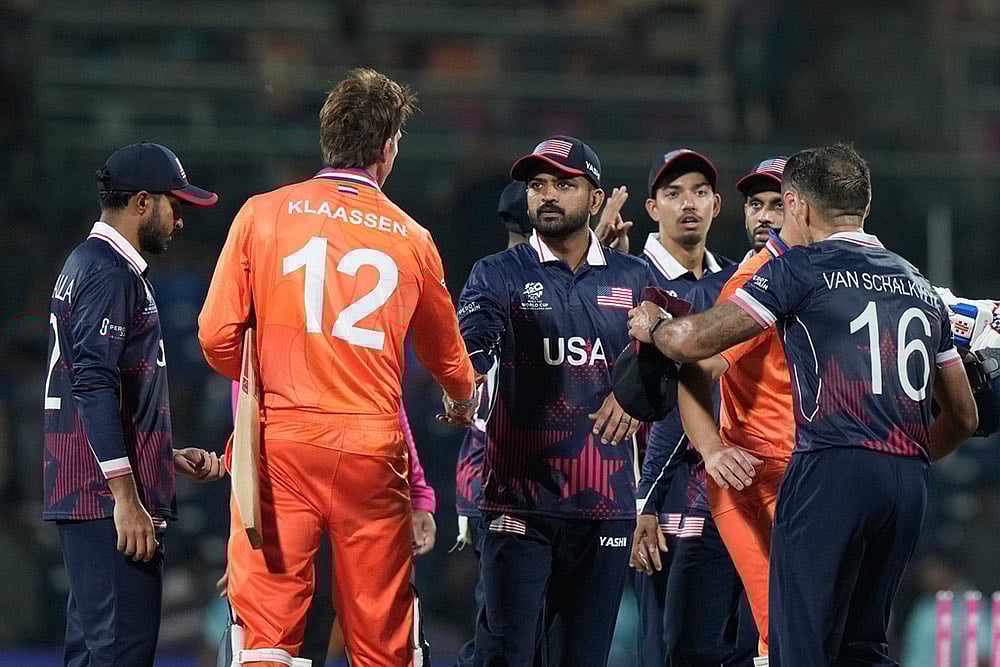 | Photo: AP/Mahesh Kumar A : United States captain Monank Patel, centre, shake hands with Netherlands Fred Klaassen after they won the T20 World Cup cricket match against Netherlands in Chennai, India.