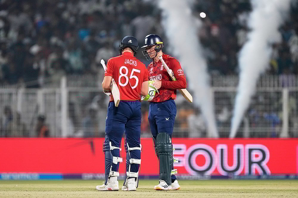 | Photo: AP/Bikas Das : Englands Will Jacks, left, and batting partner Tom Banton celebrate after England won the T20 World Cup cricket match against Scotland in Kolkata.