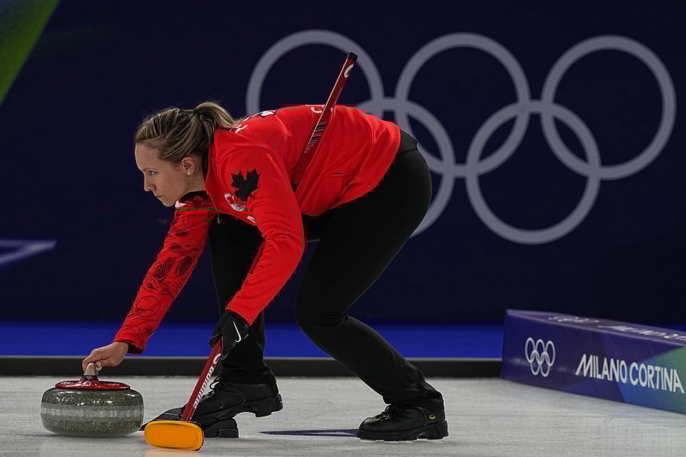 | Photo: AP/Fatima Shbair : Canadas Rachel Homan in action during the womens curling round robin session against Switzerland at the 2026 Winter Olympics, in Cortina dAmpezzo, Italy.