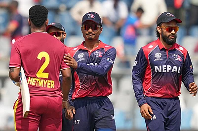 | Photo: AP/Rafiq Maqbool : West Indies Shimron Hetmyer, left shake hand with Nepals captain Rohit Paudel at the end of the play during the T20 World Cup cricket match between Nepal and West Indies in Mumbai.