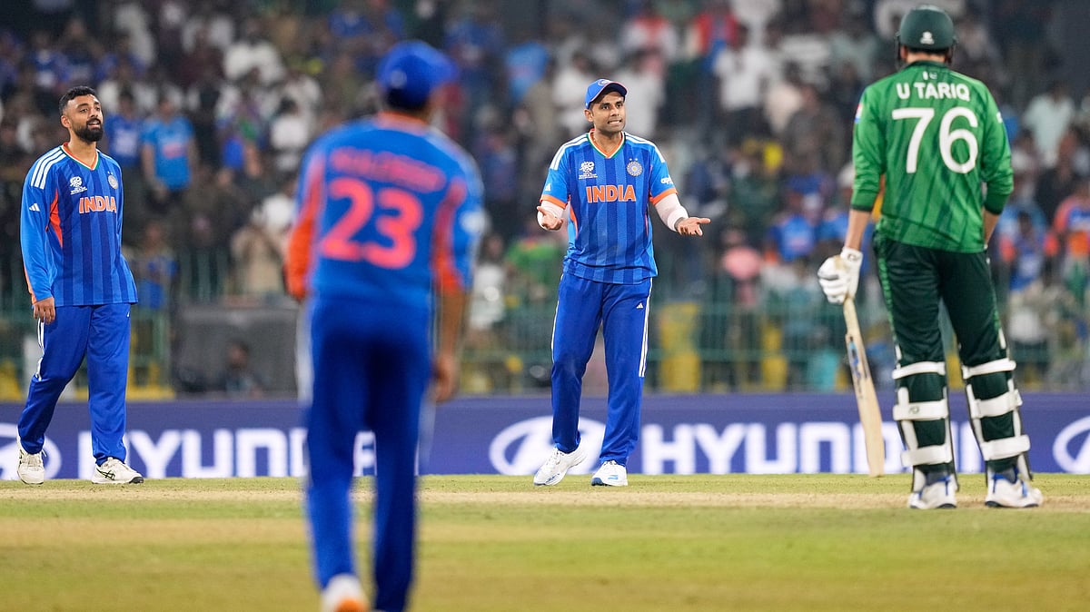 AP : ndias captain Suryakumar Yadav, second right, consults teammate Ishan Kishan, unseen, as he decides whether to take a review for the wicket of Pakistans Usman Tariq, right, during the T20 World Cup cricket match between India and Pakistan in Colombo, Sri Lanka, Sunday, Feb. 15, 2026